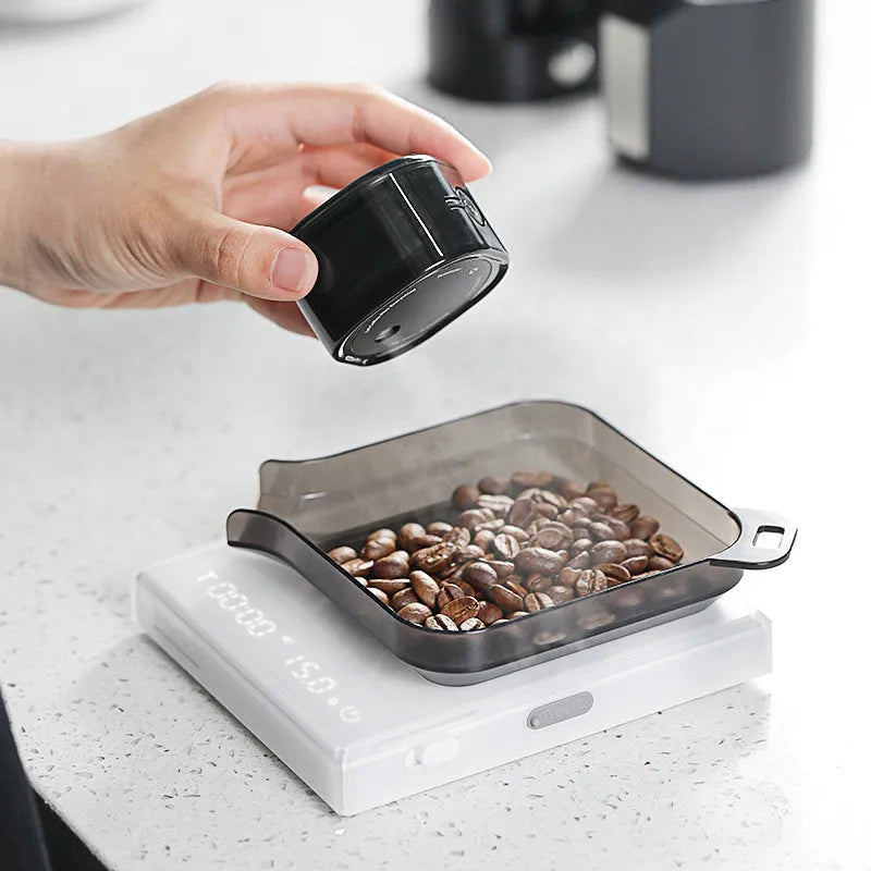 Electric coffee bean sprayer for anti-fly powder in black or silver, simple style for cafes and home use