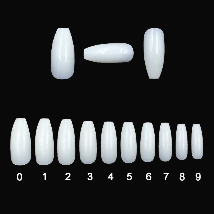 500 clear acrylic false nails in 10 sizes, made from ABS plastic, arranged on a table.