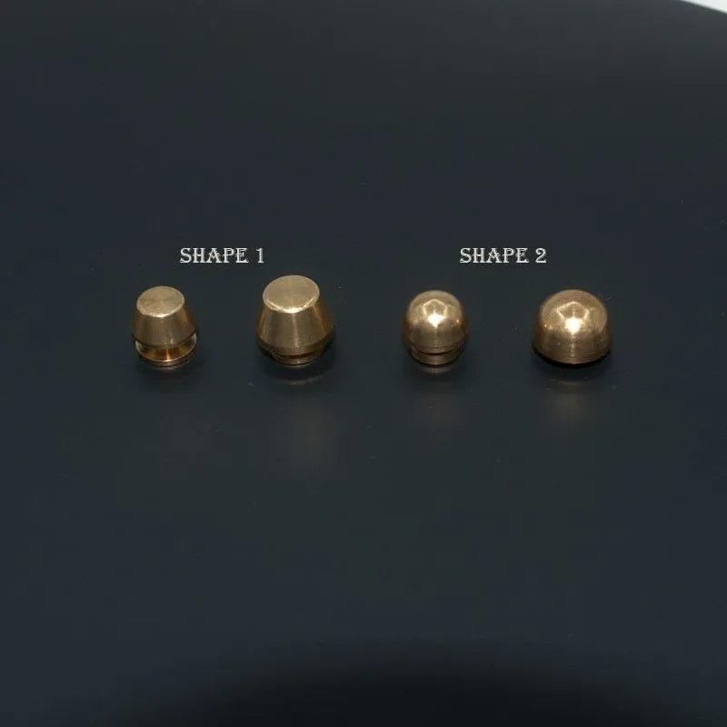 Brass decorative belt buckle showing round and bucket foot nail shapes in 10x6mm and 12x7mm sizes.