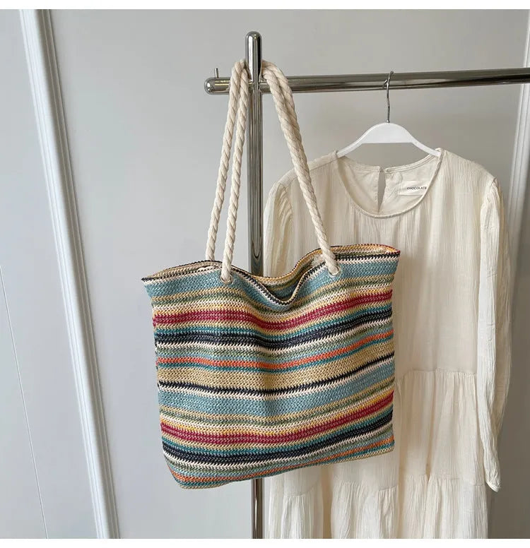 Blue woven nylon shoulder bag with large capacity and straw-style texture showing single-shoulder strap and polyester lining.