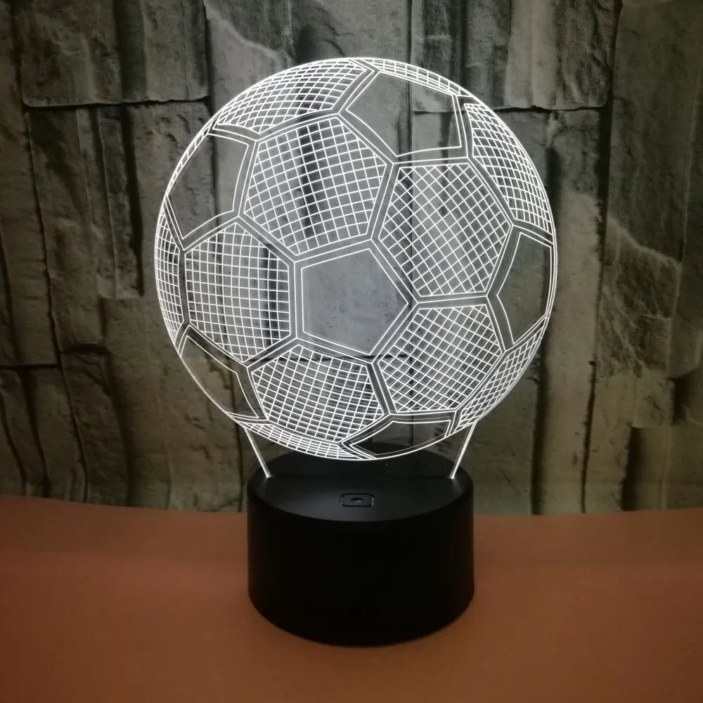 3D football shaped LED night light showing multiple colour options on a dark surface.