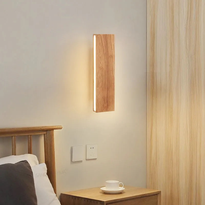 Solid wood Nordic Japanese style LED wall lamp mounted on bedroom wall with warm light, available in 22cm 32cm 52cm sizes