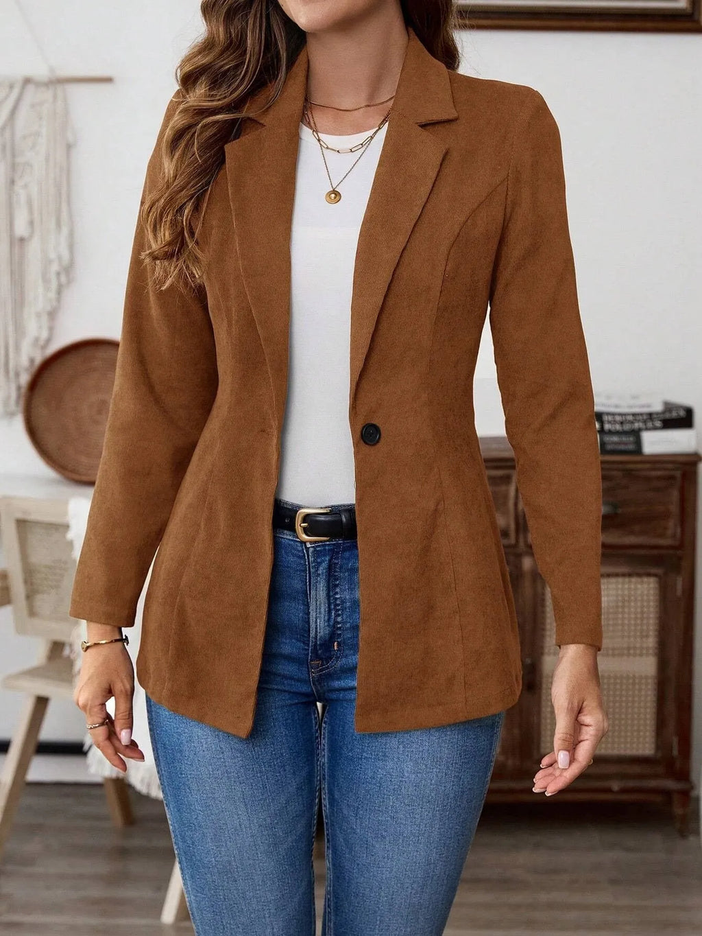 Brown men's single-breasted suit jacket with lapel collar and long sleeves.