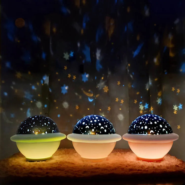 UFO-shaped star projection night light with rotating star patterns in green, pink or white colours