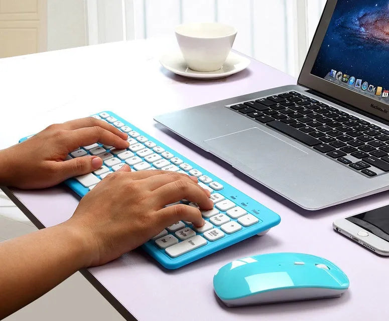 Black wireless keyboard and mouse set on a desk showing compact 96-key layout and adjustable DPI mouse.
