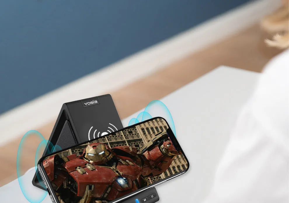 Black Bluetooth speaker with integrated phone stand featuring wireless charging and 2000mAh power bank