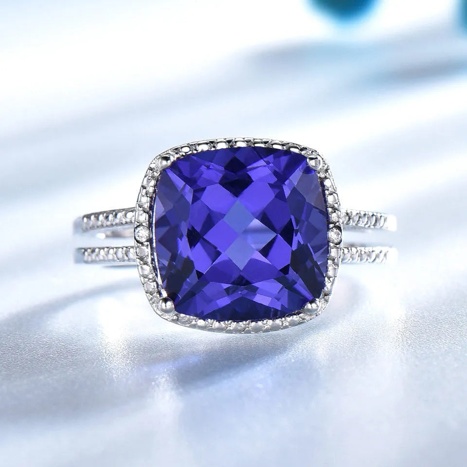 Close-up of a blue tanzanite stone set in a sterling silver women's ring.