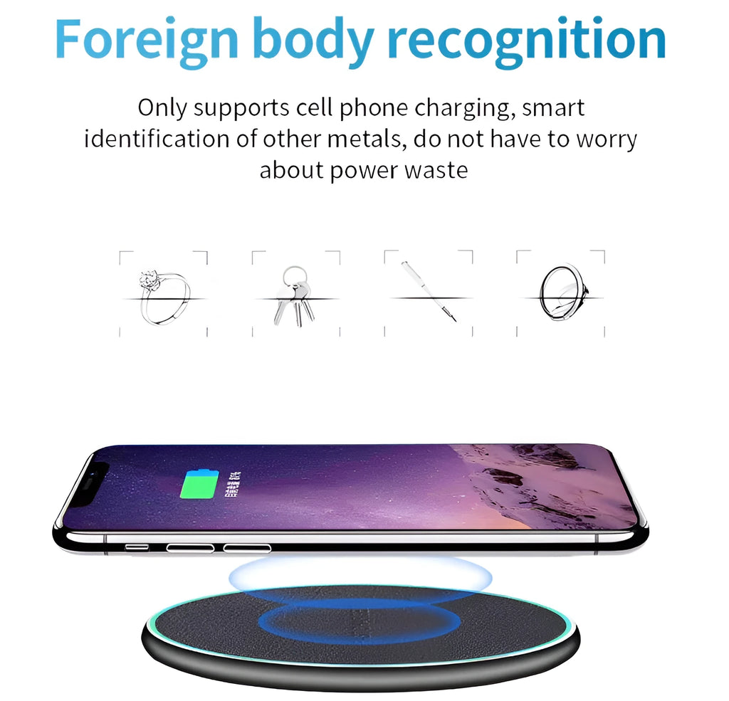 Black Quick Qi wireless charging pad on a desk, compatible with iPhone 11.
