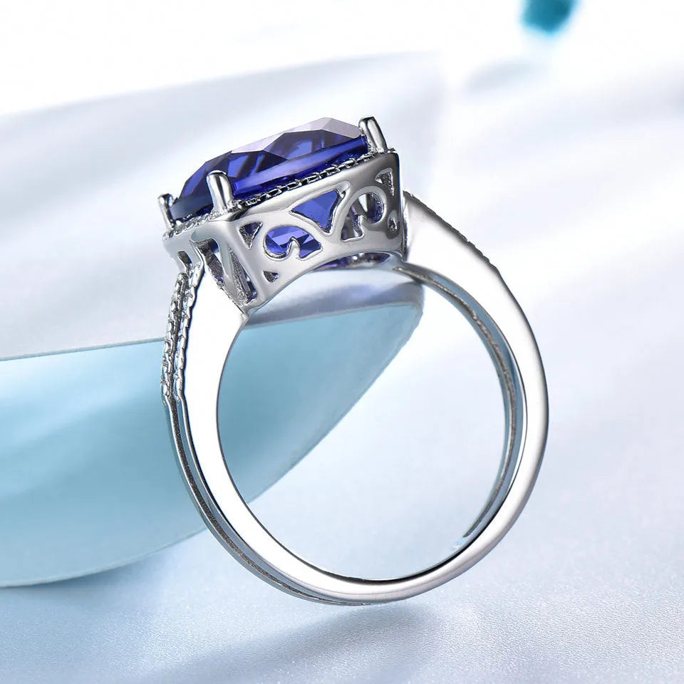 Close-up of a blue tanzanite stone set in a sterling silver women's ring.