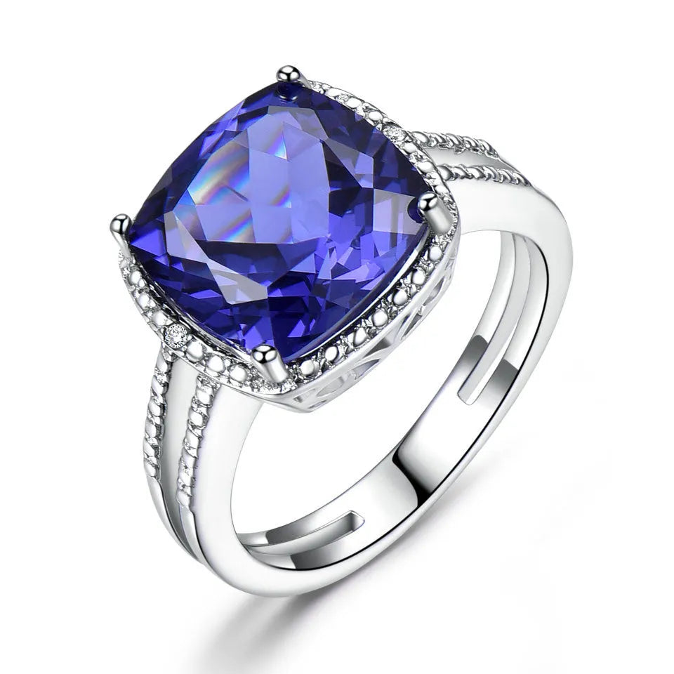 Close-up of a blue tanzanite stone set in a sterling silver women's ring.