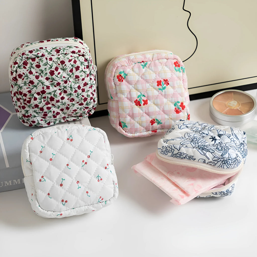 Polyester women's key storage bag with floral pattern choices on white background.