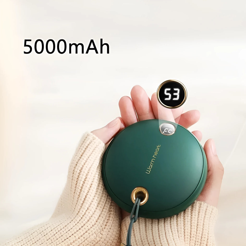 Green 5000mAh hand warmer power bank with digital display, shown next to its included USB charging cable.
