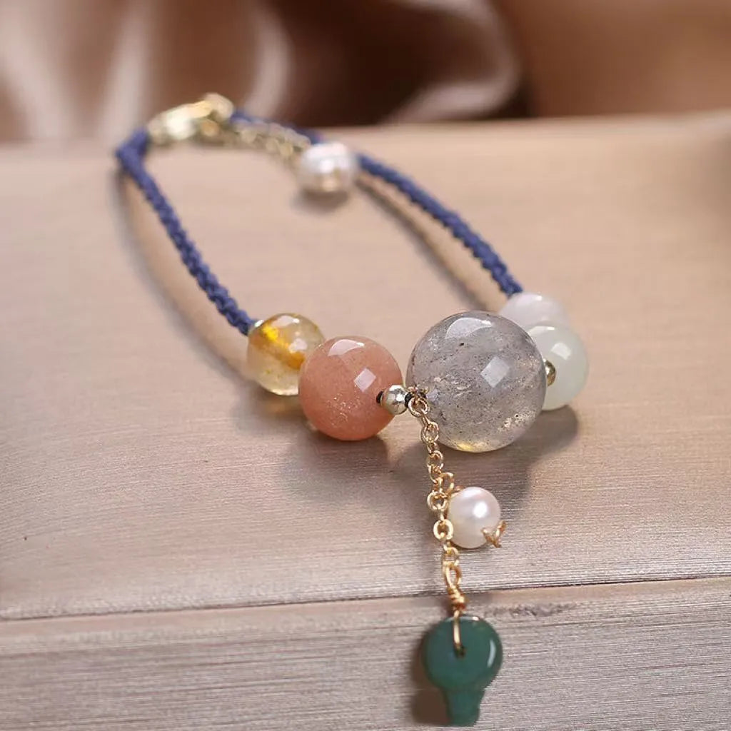 Hand-woven women's bracelet with peace buckle design in crystal material with sequin detailing