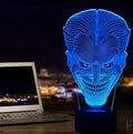 3D acrylic LED table lamp with USB cable and remote control on a desk