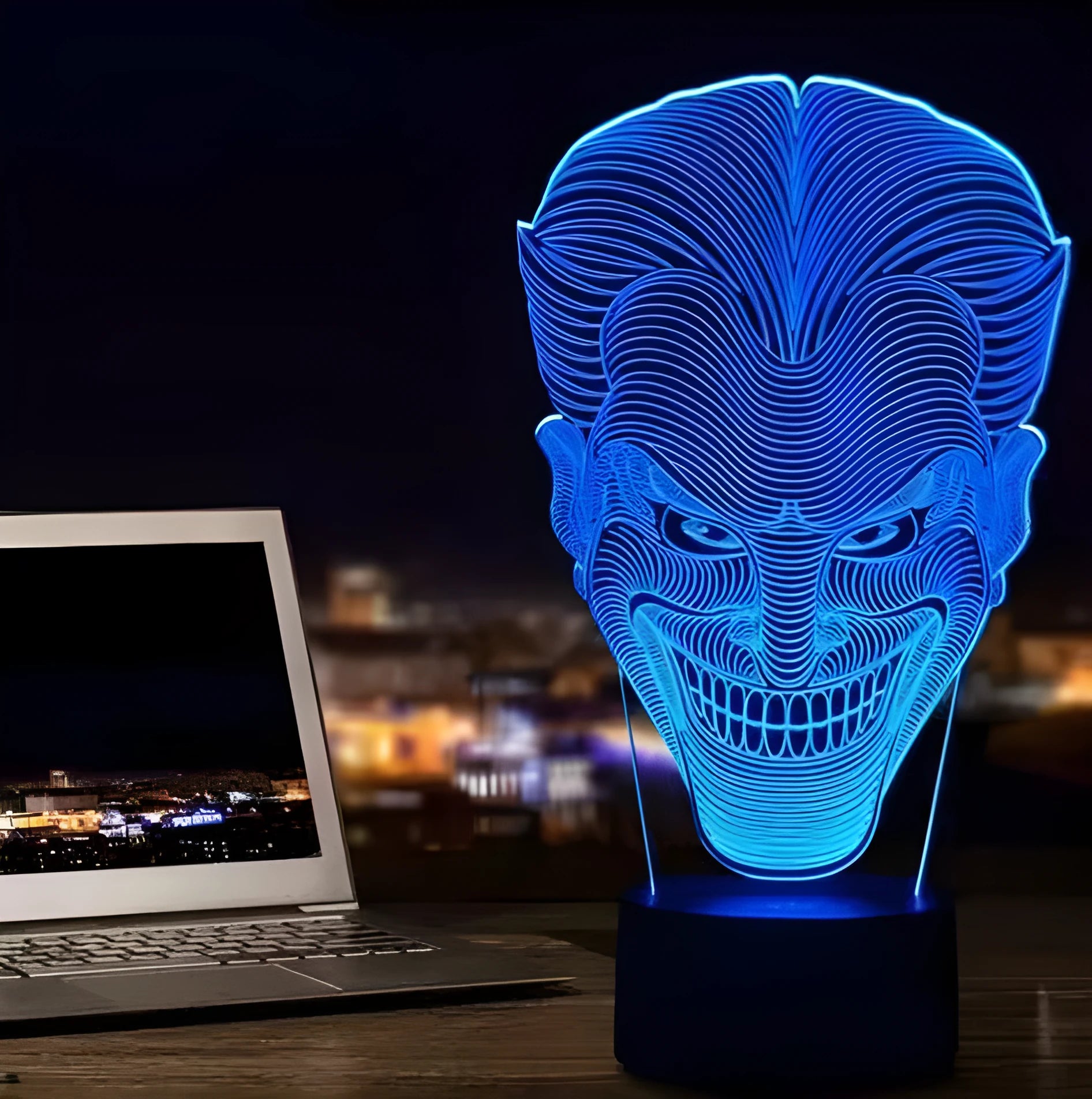 3D acrylic LED table lamp with USB cable and remote control on a desk