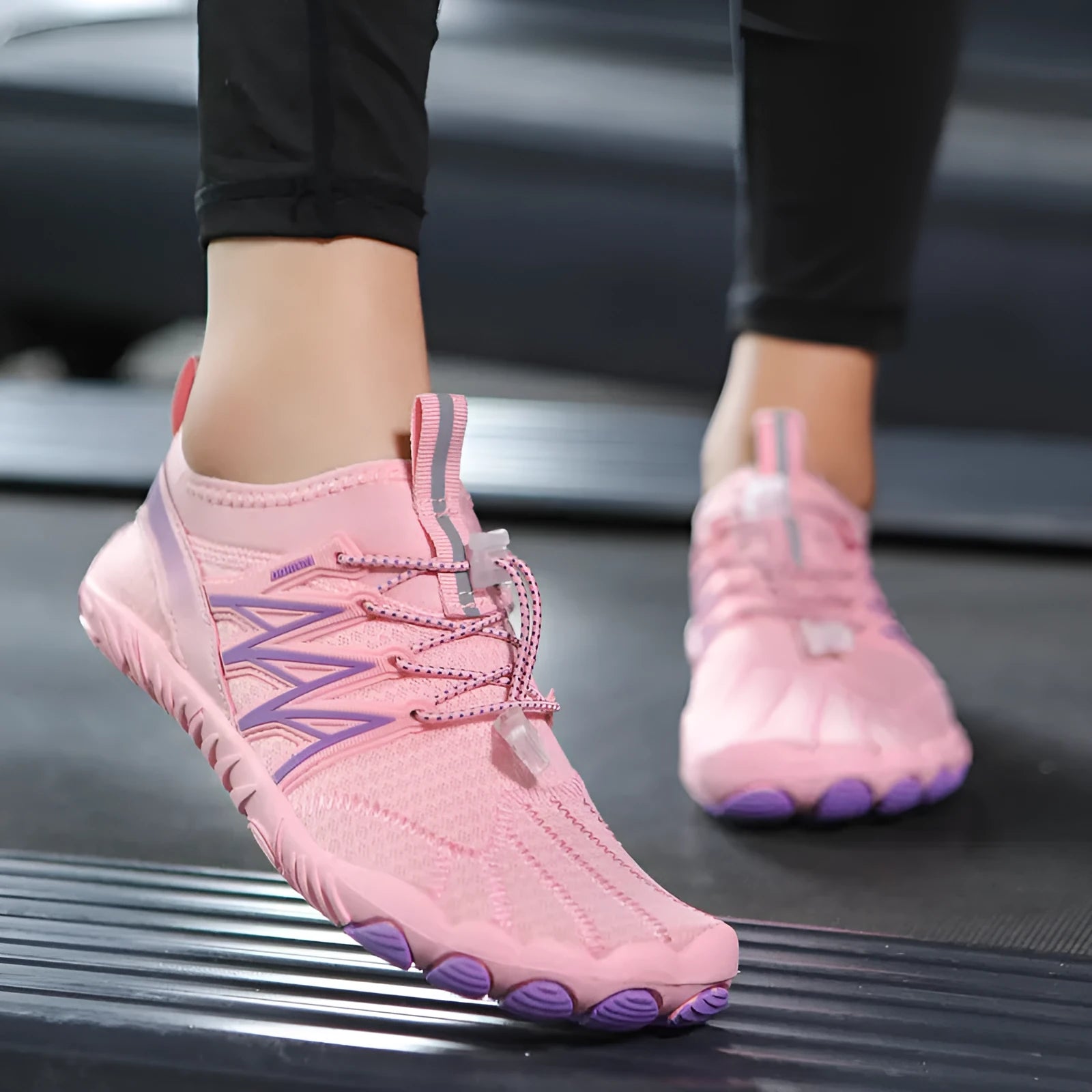Lightweight indoor fitness training shoes with striped mesh upper and rubber sole in multiple colours.