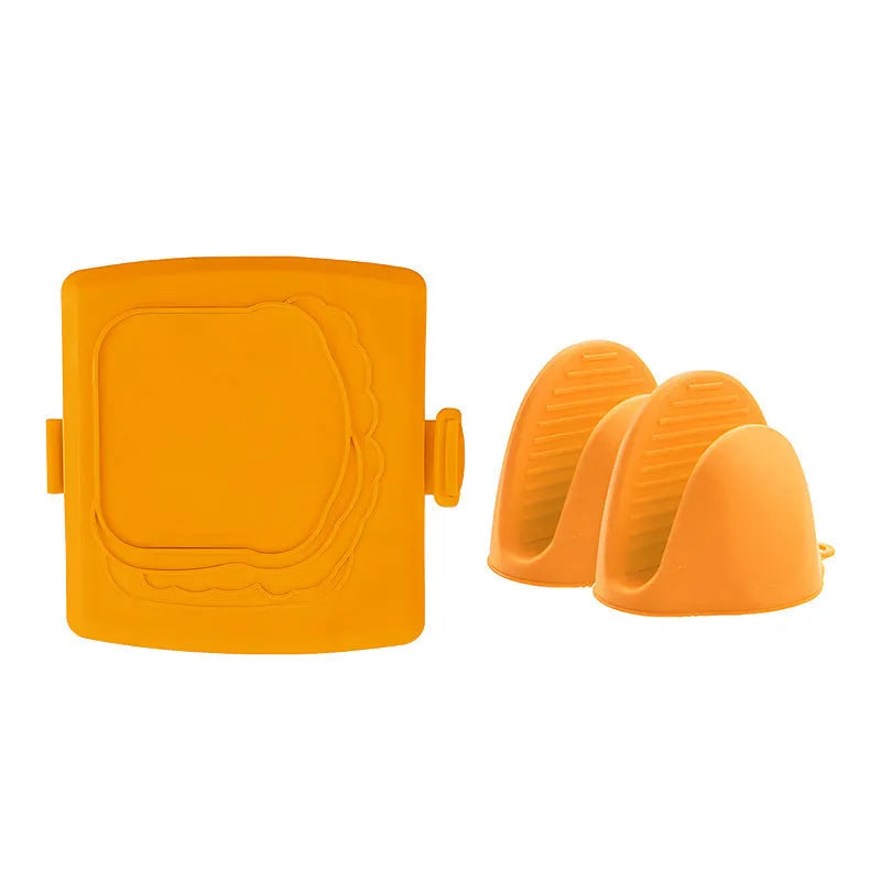 Red silicone baking tray with matching anti-scald gloves on kitchen counter