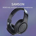 Fully enclosed headworn monitoring earphones in black industrial style, one pair