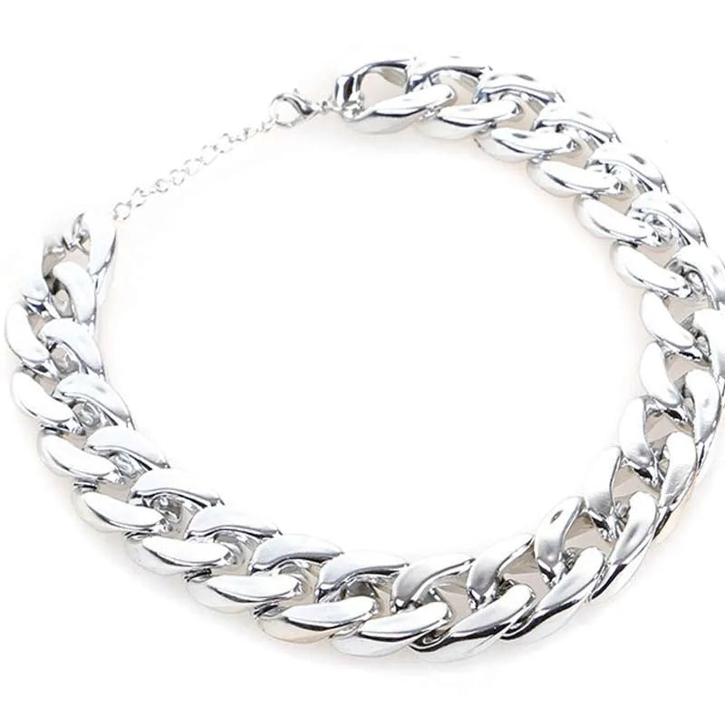 Gold colour twisted chain dog collar with buckle fastener on a white background.