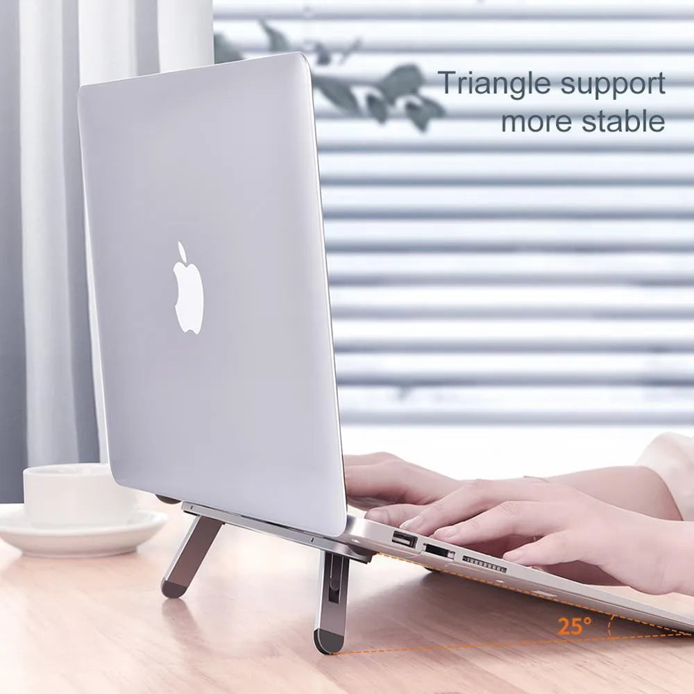 Aluminium alloy laptop stand 216x26mm in silver with silicone pads on desk