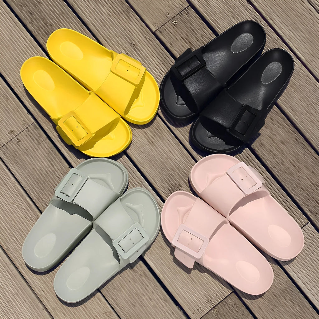 Women's grey blue EVA buckle sandals with an adjustable strap on a white background.