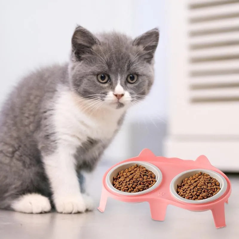 Blue ceramic cat food and water bowl set on a white elevated stand with a storage hook.