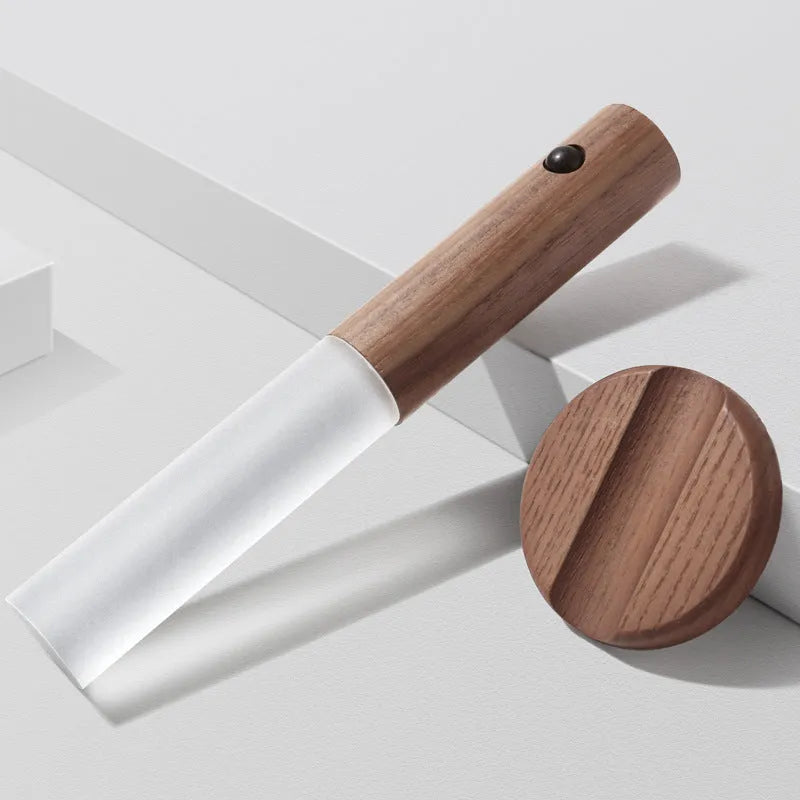 Smart sensor LED desk lamp in solid wood and organic glass with automatic motion activation.