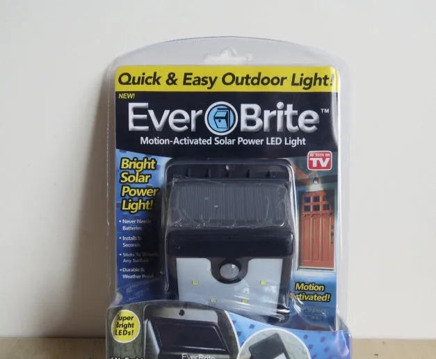 Four solar-powered LED sensor lights for outdoor garden and security lighting