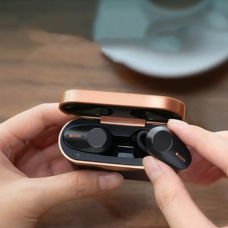 Black wireless Bluetooth headset with charging case showing ANC noise cancellation and dual charging options