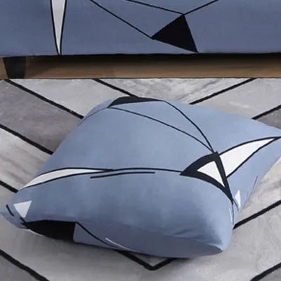 Printed geometric stretch sofa slipcover fitted on a three-seater sofa