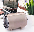 Portable metal subwoofer speaker with buttons, available in black, blue, gold, red, and silver colours.