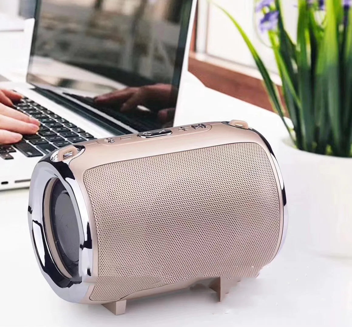 Portable metal subwoofer speaker with buttons, available in black, blue, gold, red, and silver colours.