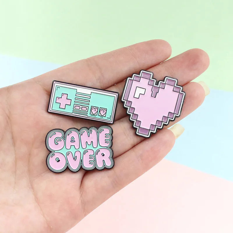 Stereo game console badge made from alloy metal in one of three colour options