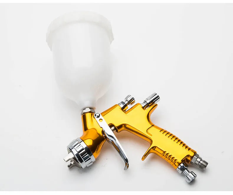 HVLP gravity feed paint spray gun with 1.3mm nozzle, aluminium alloy body and 600cc plastic pot in gold