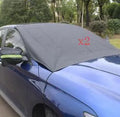 Car windshield snow cover in black and silver waterproof polyester taffeta, 210 x 120cm, with reflective night bar and four magnets.