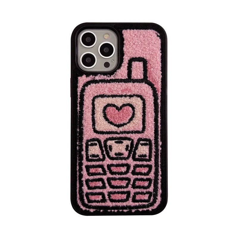 Pink towel embroidered soft TPU case for iPhone on a table.