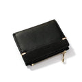 Women's black PU leather bifold wallet open to show card slots, zipper compartment, and change pocket.