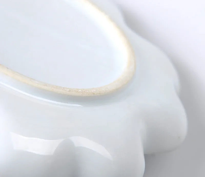 White ceramic plum blossom shaped artist palette for oil, watercolour and acrylic painting