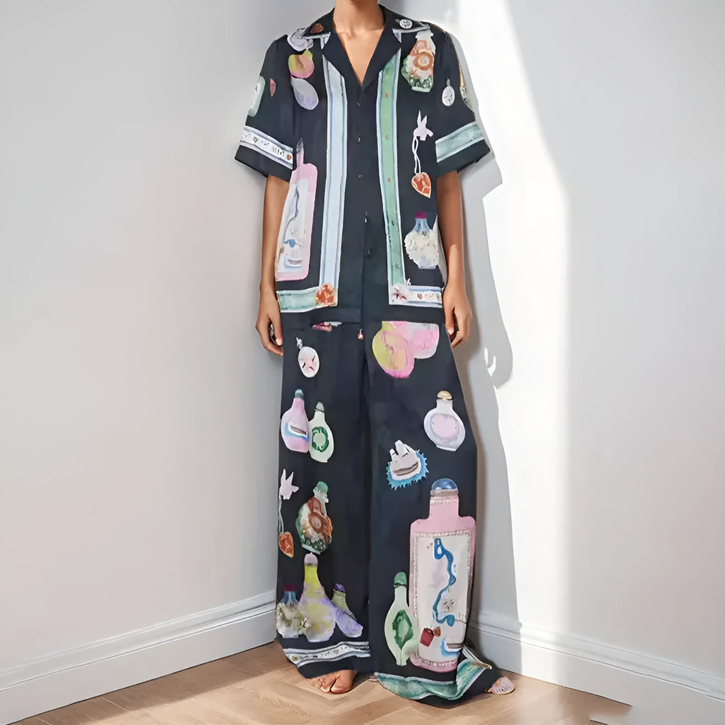 Women's black casual two-piece set with cartoon animation print, cardigan sleeve top, and matching trousers