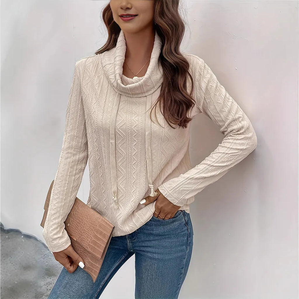 Apricot coloured hooded pullover sweater with long sleeves and drawstring hood