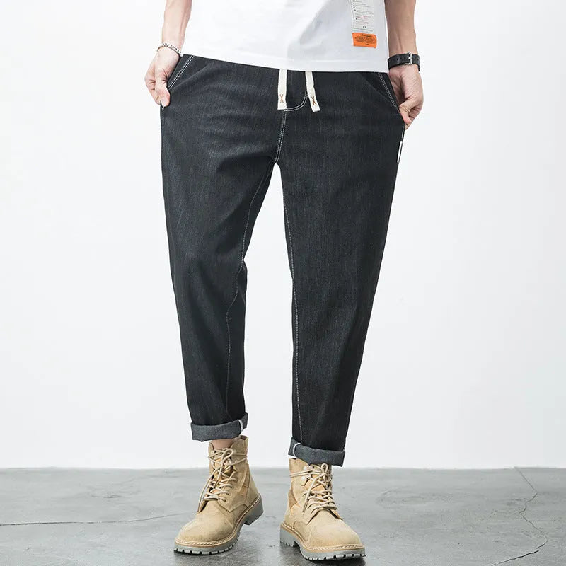 Men's loose fit plus size jeans with elastic mid waist, thin cotton denim, blue or black, sizes L to 7XL