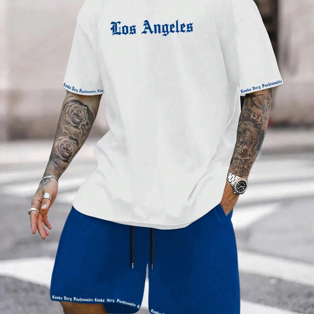 Man wearing a grey short sleeve athletic top and matching shorts from a polyester sportswear set.