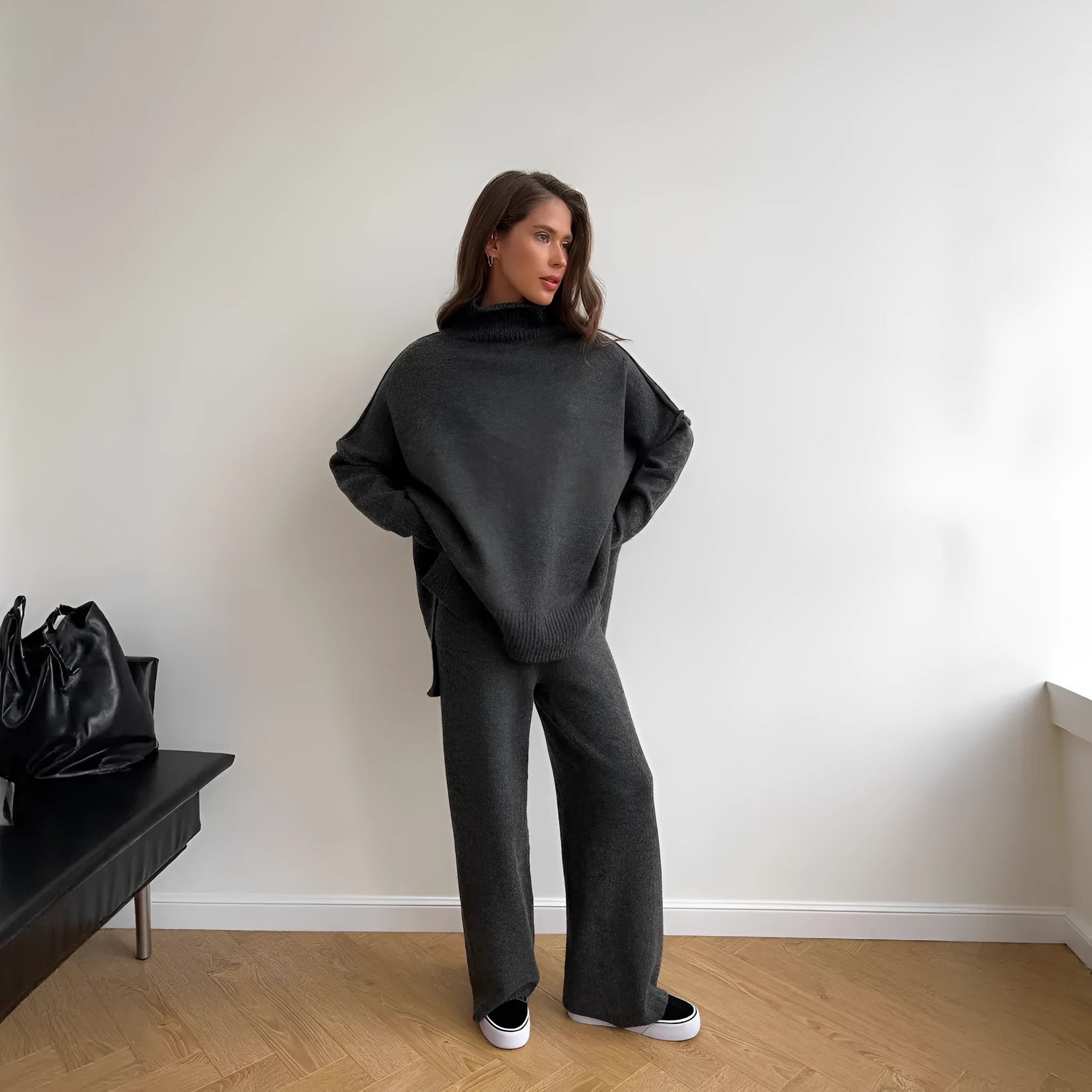 Women's acrylic knit sweater suit with side-slit top and matching trousers in dark grey