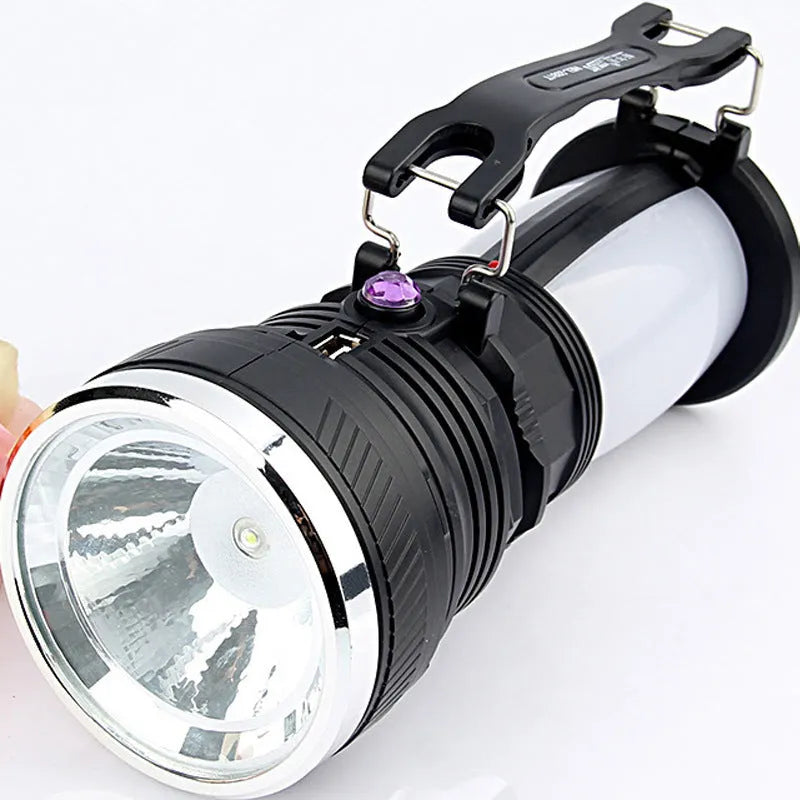 Black solar-panel and USB rechargeable LED flashlight for outdoor and emergency use.