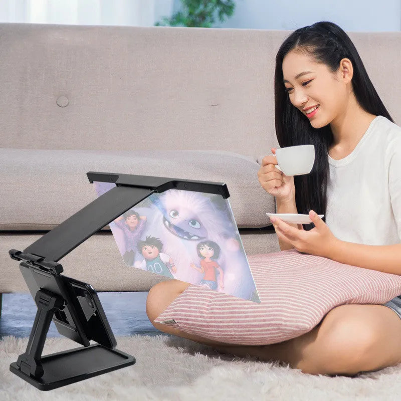 Black L20 split mobile phone screen magnifier with a separate support bracket on a table.