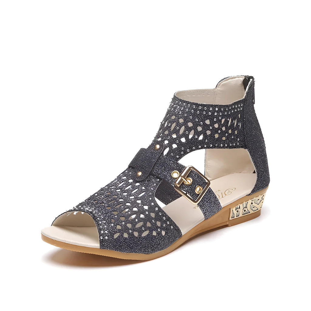 Women's beige flat sandals with a back zipper and low wedge heel.
