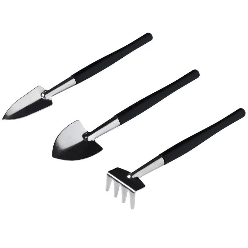 16-piece black mini garden hand tools set for succulents and bonsai on a 75cm cushion.