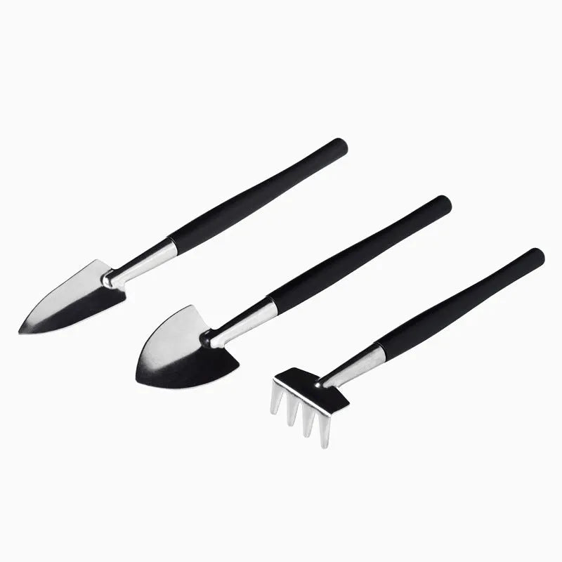 16-piece black mini garden hand tools set for succulents and bonsai on a 75cm cushion.