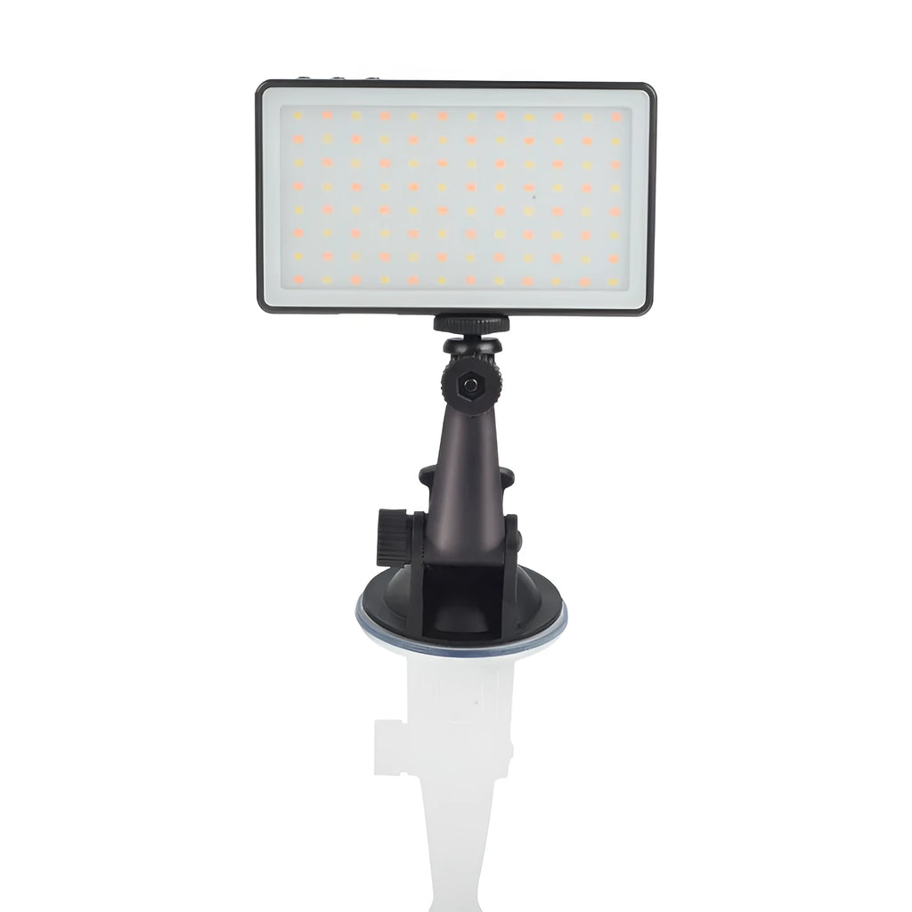 Black aluminium LED video conference light showing its slim profile and LED array, placed next to a laptop.