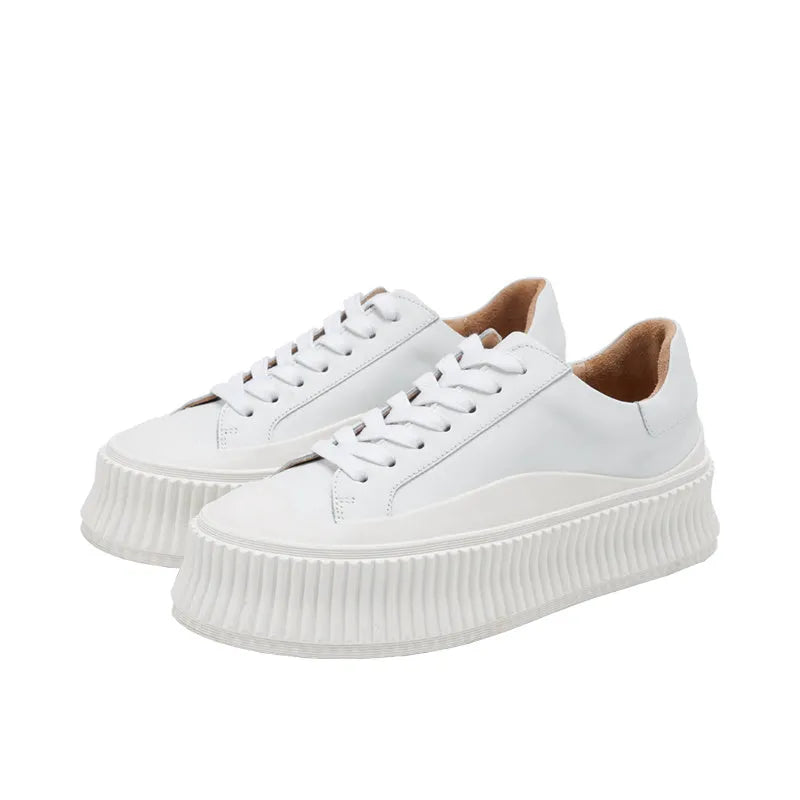 Women's small white trainers with thick sole and suede leather upper in INS tide style